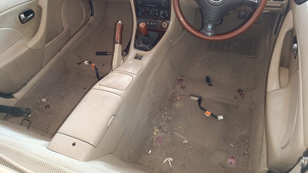 Image showing heated seat connectors on floor of interior once seats removed.