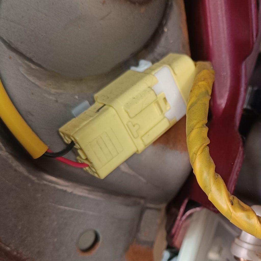 Image of passenger air bag connector under dash