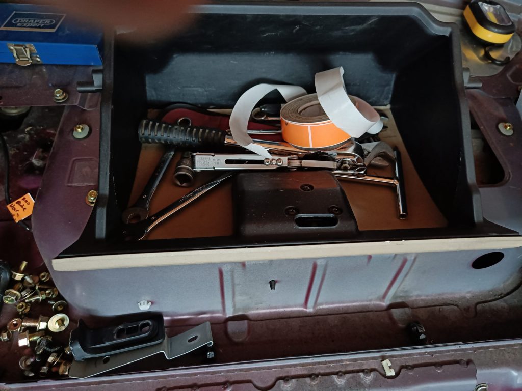 Image of removed glove box being used as a tool box!