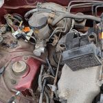 Image showing coolant header tank removed along with EVAP charcoal cannister, relays and fusebox.