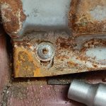 Image of tamperproof fitting on passenger footrest. ECU is behind here!
