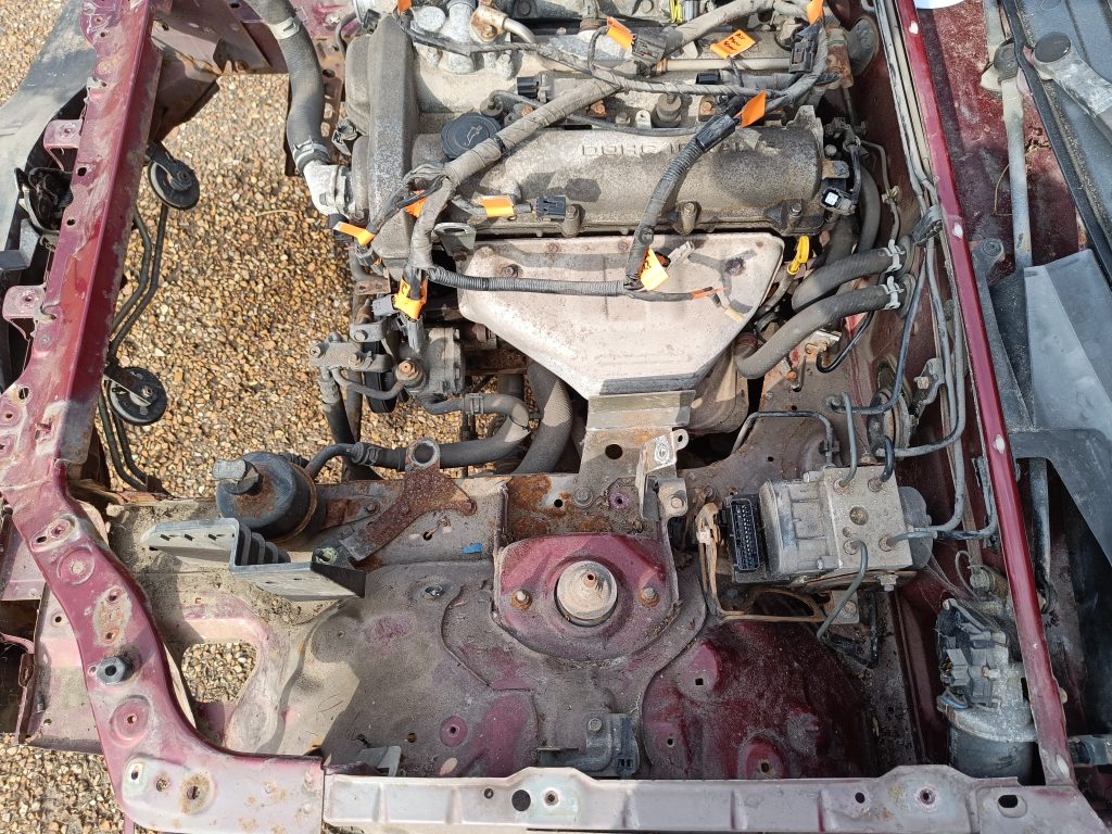 Image showing engine bay with radiator and N/S loom removed.