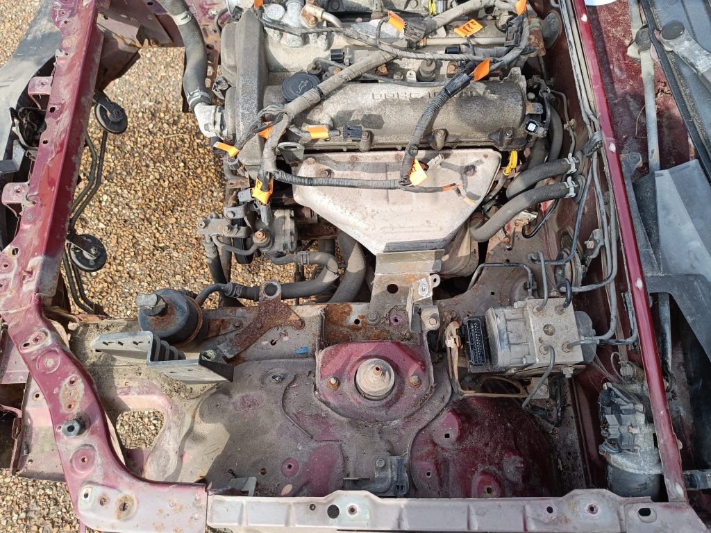 Image showing engine bay with radiator and N/S loom removed.