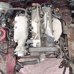 Image of engine bay without wiring harnesses.