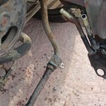 Image of front anti-roll bar unbolted from body shell.