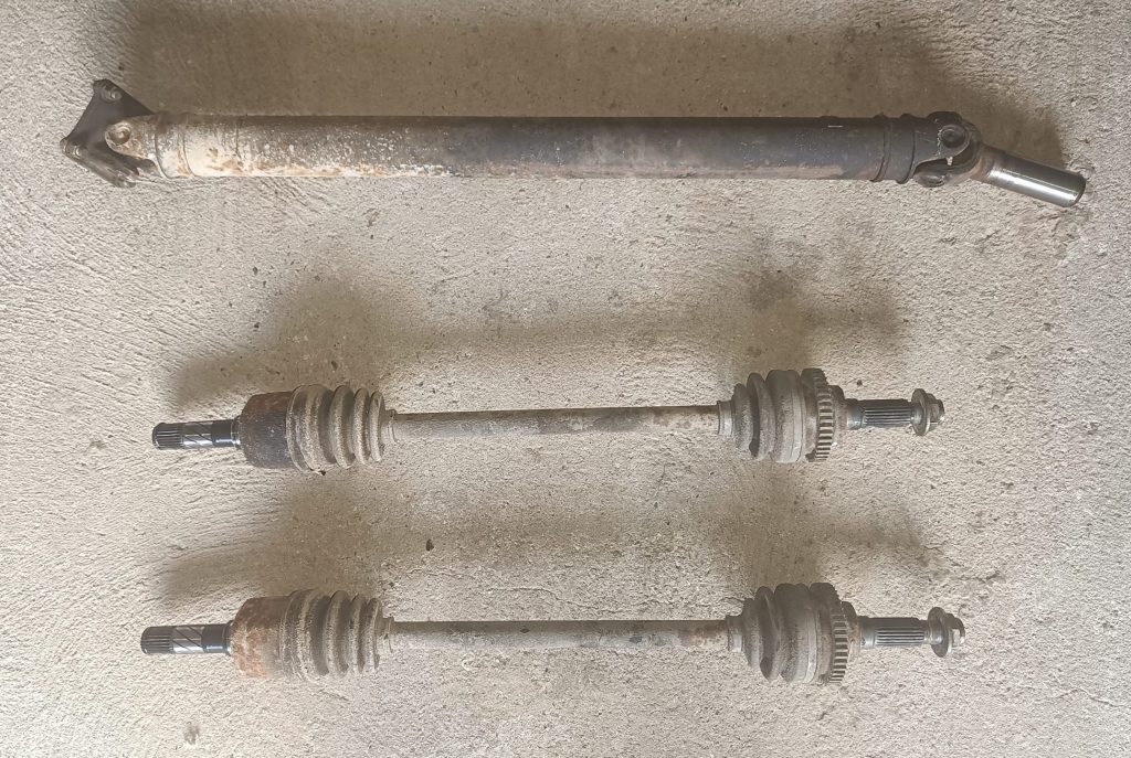 Image of removed propshaft and driveshafts ready for refurbishmant.
