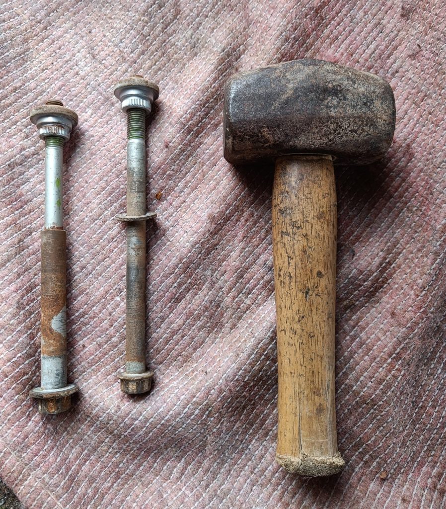 Image of PPF bolts with upper bushings after hammer applied.