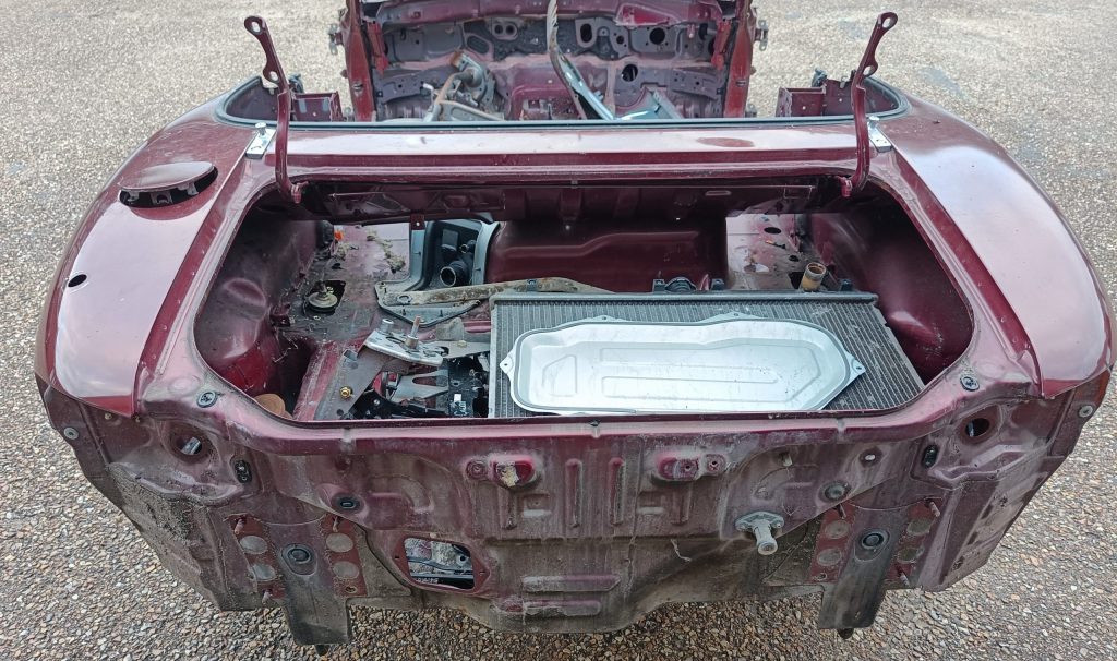 Image of scrap items inside boot space