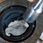 Image of 1/2" socket extension used to roll over the edge of the diff bush prior to knocking out.