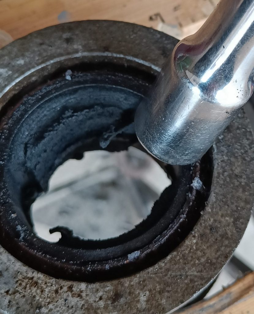 Image of 1/2" socket extension used to roll over the edge of the diff bush prior to knocking out.