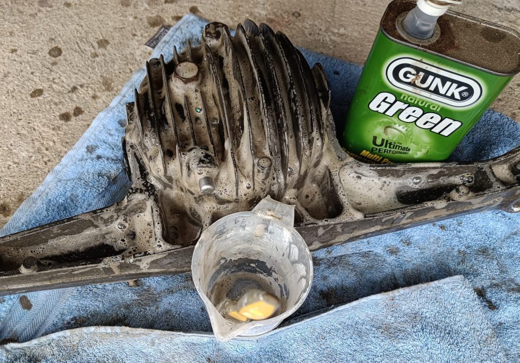 Image of diff housing soaking in degreaser.