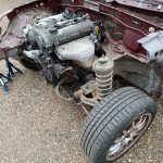 Image of donor MX5 with front panels and N/S inner wing / chassis rail removed.
