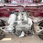 Image of donor MX5 with all front panels removed, along with front coil overs.