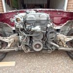 Image of donor MX5 with all front panels removed, along with front coil overs.
