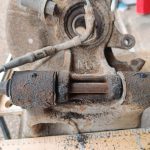 Image of lower rear wishbone in workmate to remove the long bolt and release the rear upright.