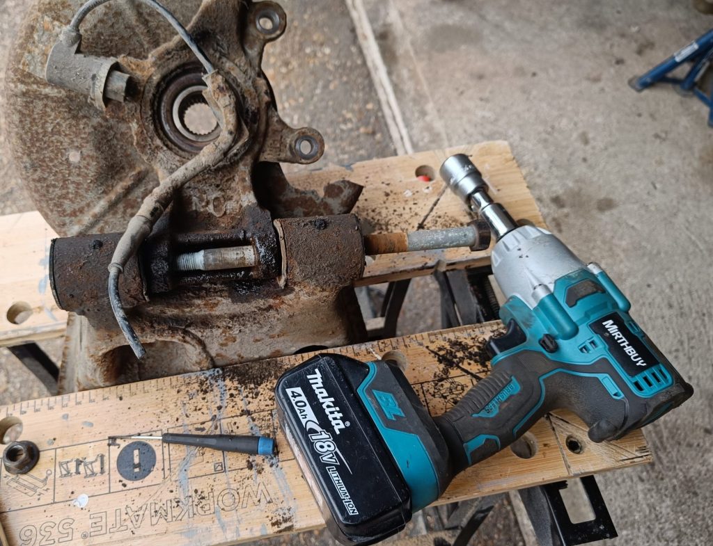 Image of lower rear wishbone with long bolt removed using the ugga dugga (eventually)!