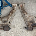 Image of both rear lower wishbones ready to go for scrap.