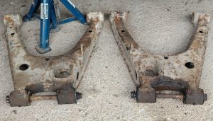 Image of both rear lower wishbones ready to go for scrap.