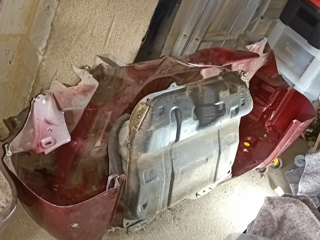 Image of rear section of MX5 body shell and fuel tank.
