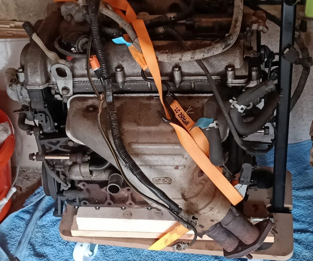 Image of removed engine sitting on trolley waiting for further dismantling and painting etc.