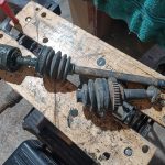 Image of n/s driveshaft being stripped down in readiness for paint.