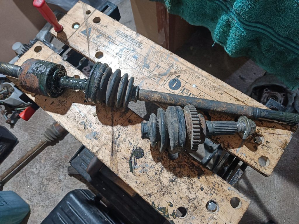 Image of n/s driveshaft being stripped down in readiness for paint.