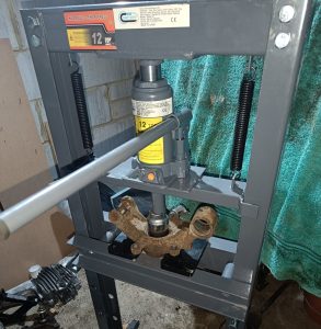 Image of my new 12-tonne press punching out a rear wheel bearing.