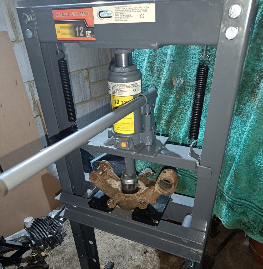 Image of my new 12-tonne press punching out a rear wheel bearing.