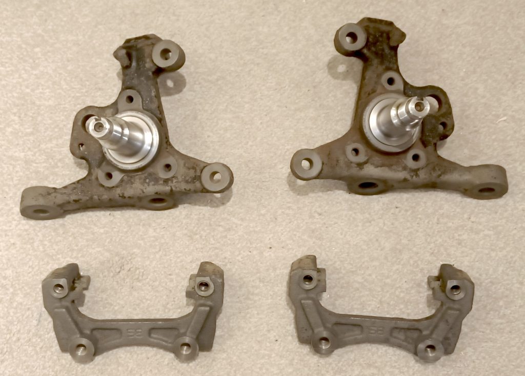 Image of front knuckles and rear caliper brackets following 24 hours immursed in 'Evaporust'.