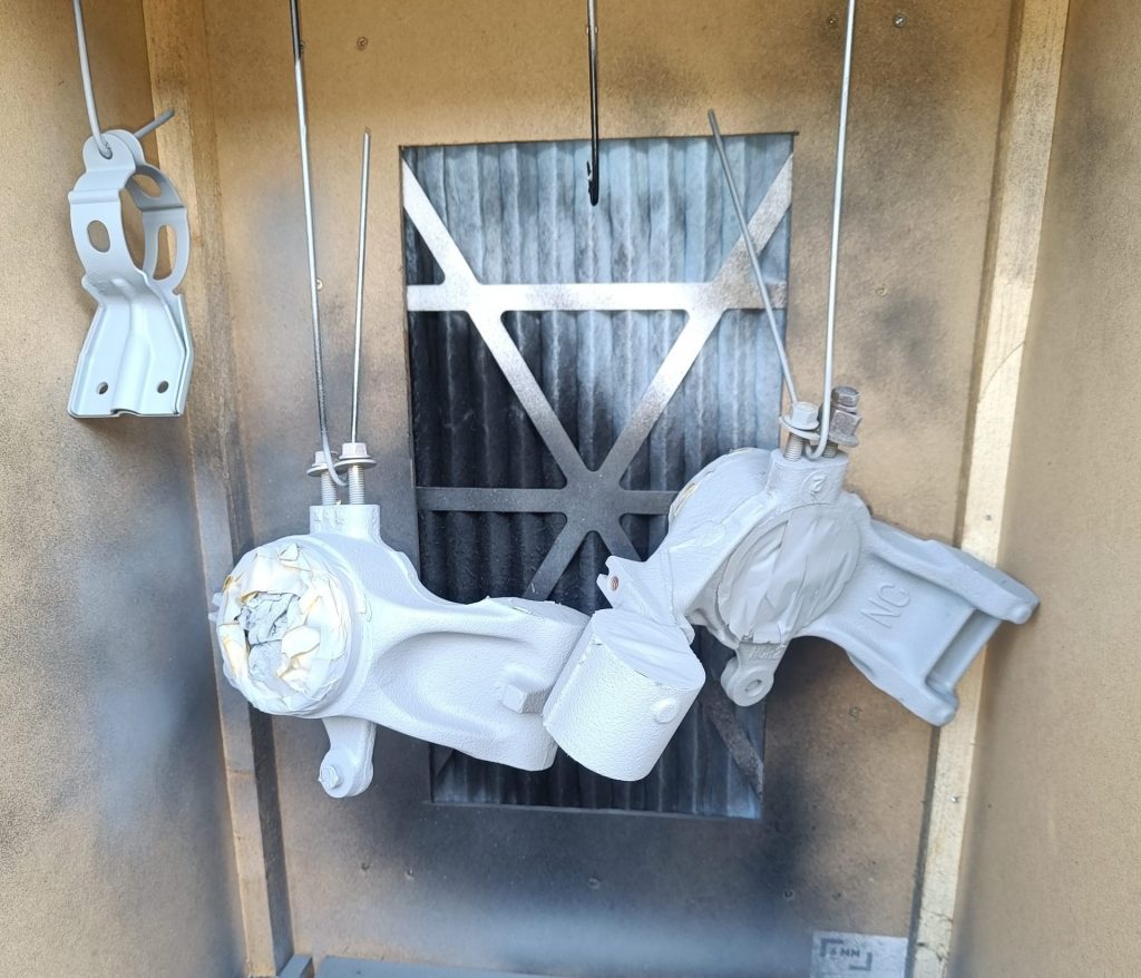 Image of etch primed rear uprights and fuel filter bracket.