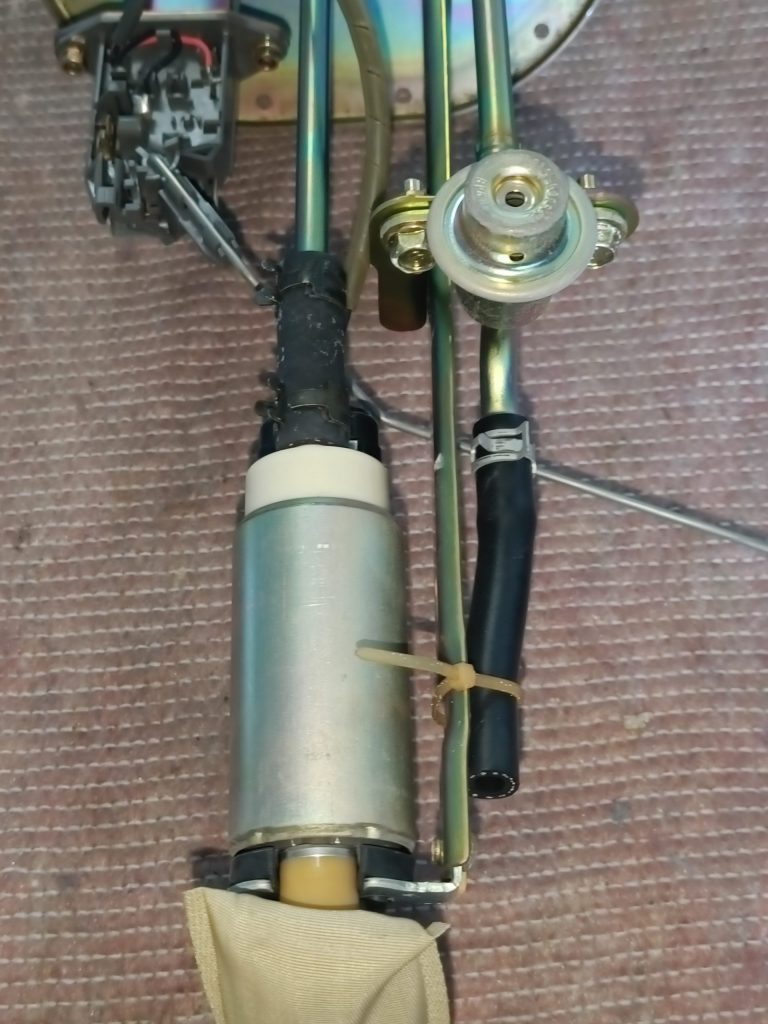 Image of close up of OE fuel pump and fuel regulator assembly.