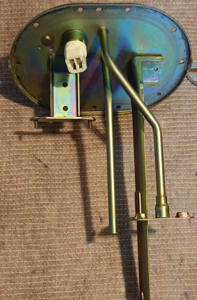 Image of stripped fuel tank assembly ready for modification.