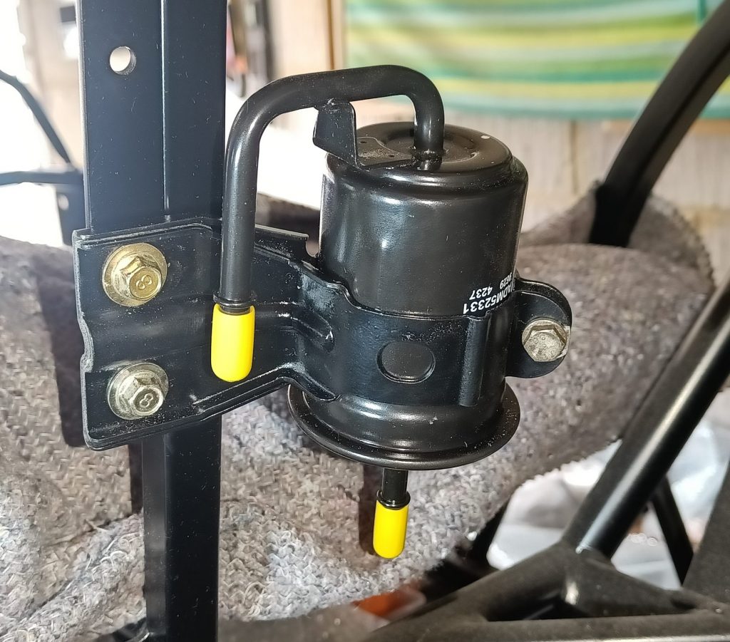 Image of fitted fuel filter and bracket.