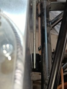 Image showing the forward most fuel tank threaded rod fitting and its clearance with the tank itself.