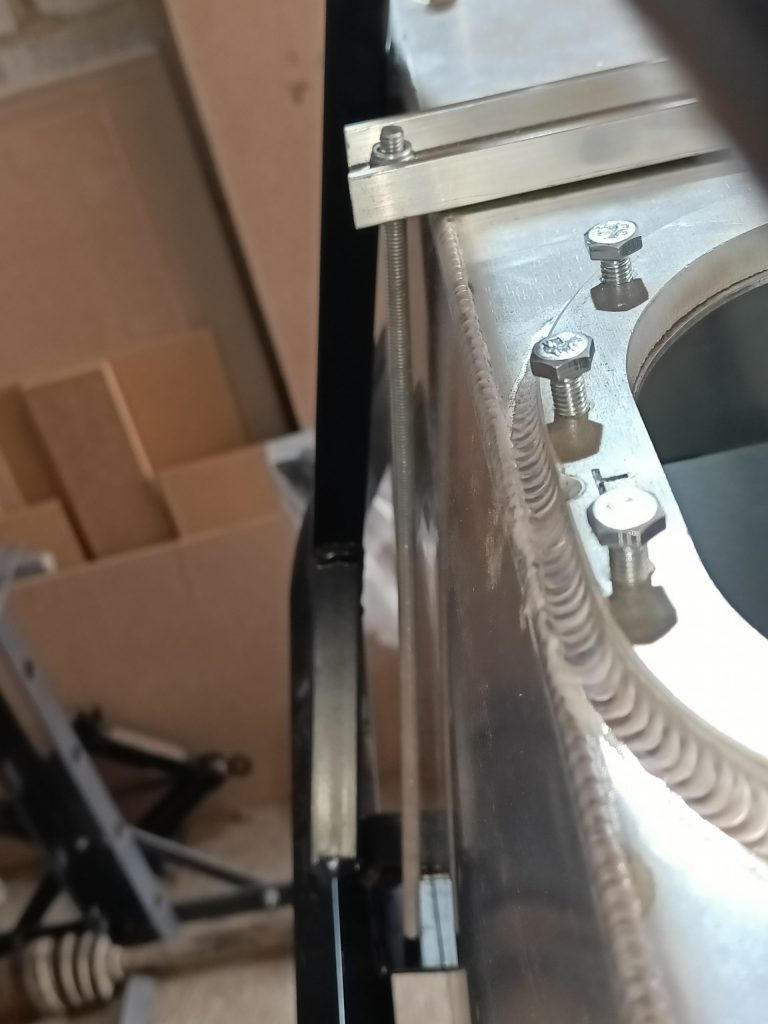 Image showing the rear most fuel tank threaded rod fitting and its clearance with the tank itself.