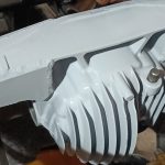Image of differential housing after final paint top coats.