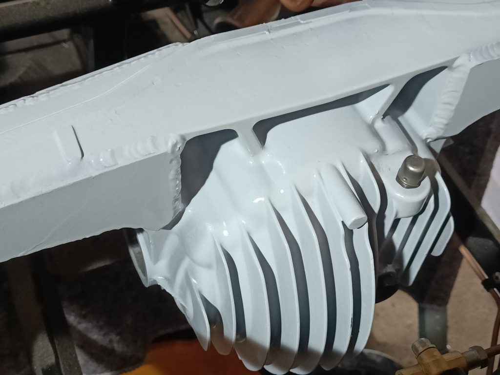 Image of differential housing after final paint top coats.