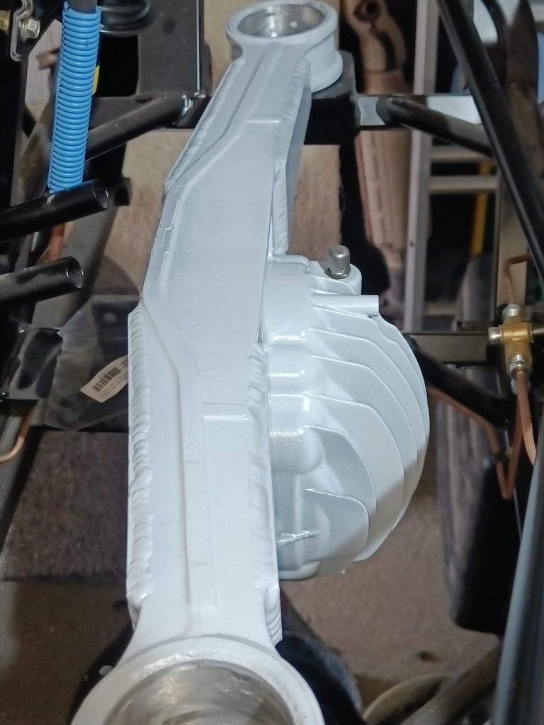 Image of differential housing after final paint top coats.