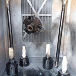 Image of stripped driveshafts and diff input flange after POR-15 paint system applied.