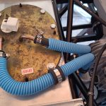 Image of fuel return re-route to clear fixings for handbrake cables.