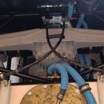Image of new handbrake cable fixing points using the fuel tank fixing rods and P clips