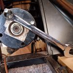 Image of bracing the diff input flange to torque the pinion nut.