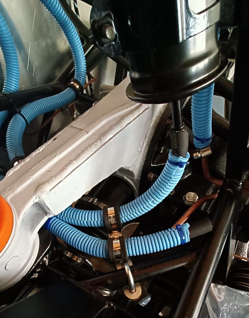Image of final flexi fuel line routing utilising custom brackets.