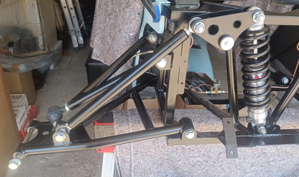 Image of OS front suspension midway through assembly