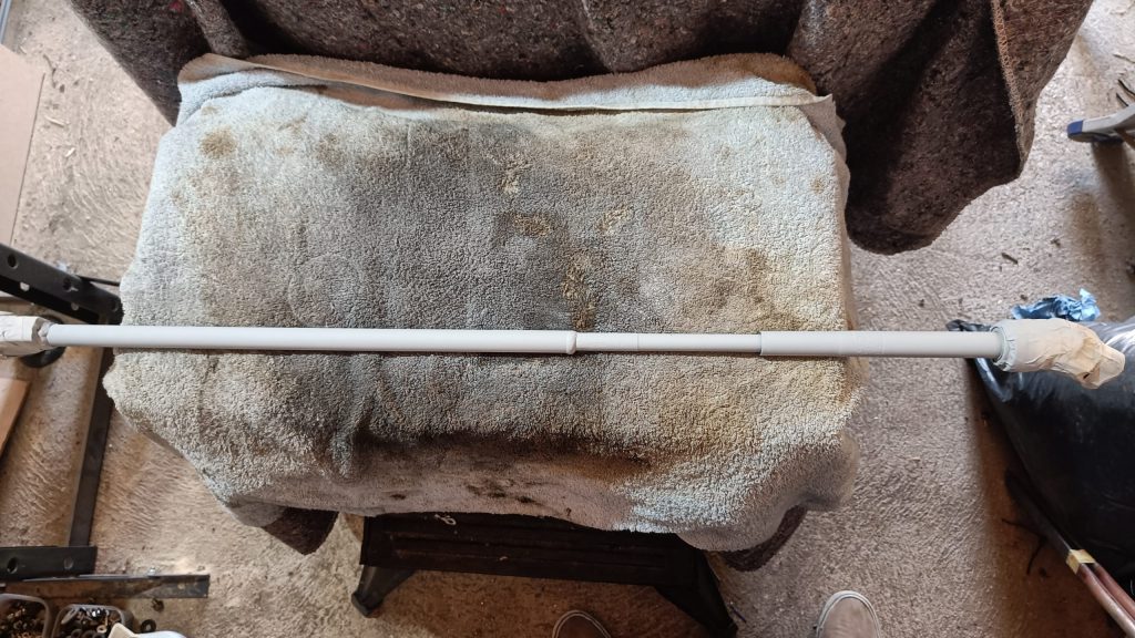 Image of lower steering column primed and ready for top coat.