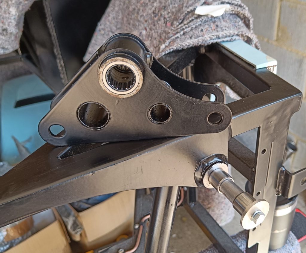 Image of NS front suspension rocker with bearings fitted together with the inner rings fitted to rocker shaft