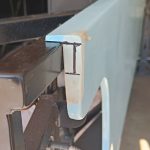 Image of front end of NS side panel marked for trimming