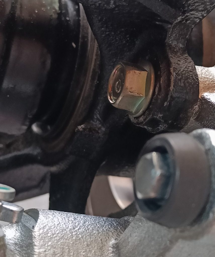 Image of fitted new OEM caliper bolts