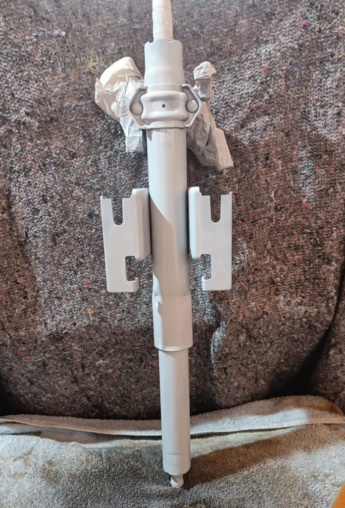 Image of upper steering column primed and ready for top coat.