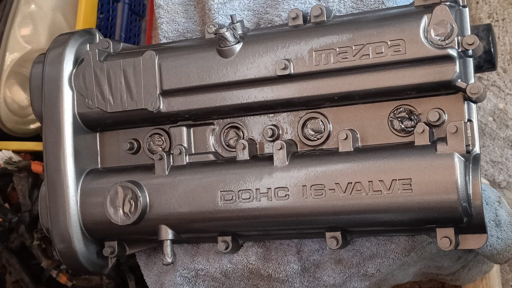 Image of camshaft cover after painting with VHT enamel paint.